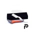 Gold and black straight razor with packing